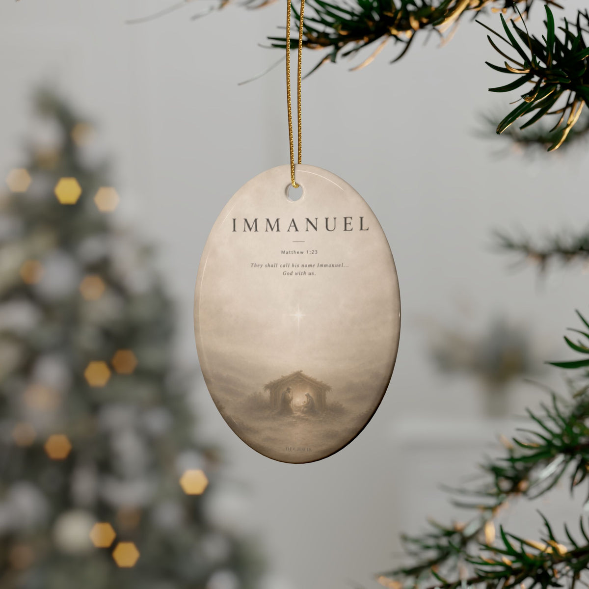 IMMANUEL Matthew 1:23 ceramic nativity ornament hanging on a Christmas tree - DECIDED.