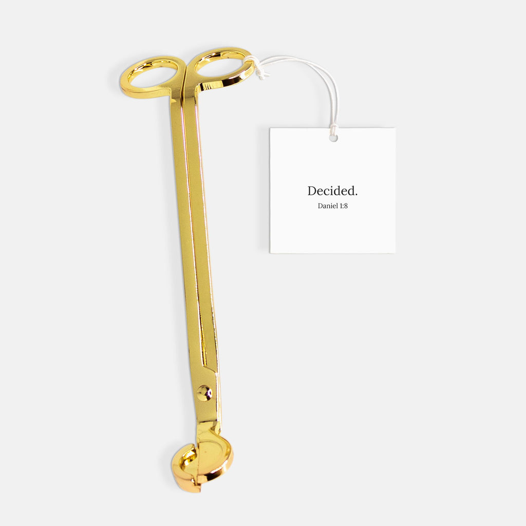 Gold candle wick trimmer with DECIDED. gift tag