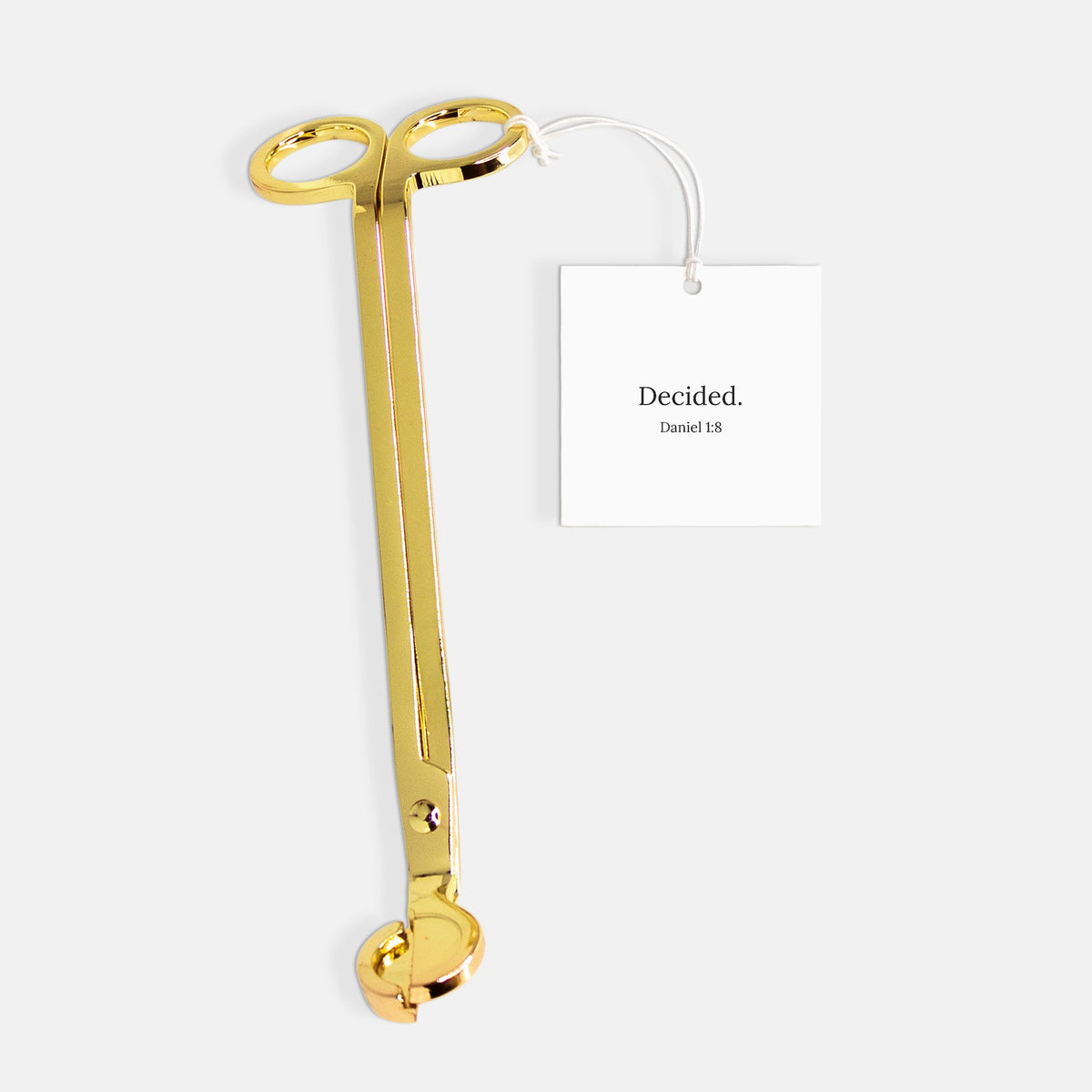 Gold candle wick trimmer with DECIDED. gift tag