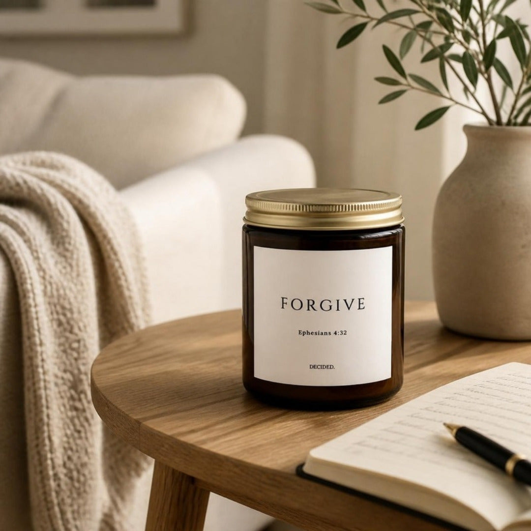 FORGIVE Ephesians 4:32 scripture candle styled in a cozy home setting - DECIDED.