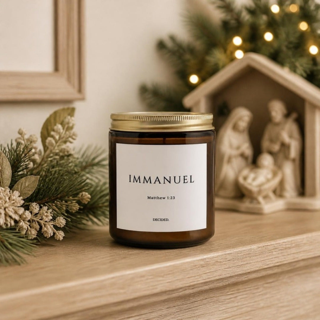 IMMANUEL Matthew 1:23 scripture candle styled in a cozy home setting - DECIDED.
