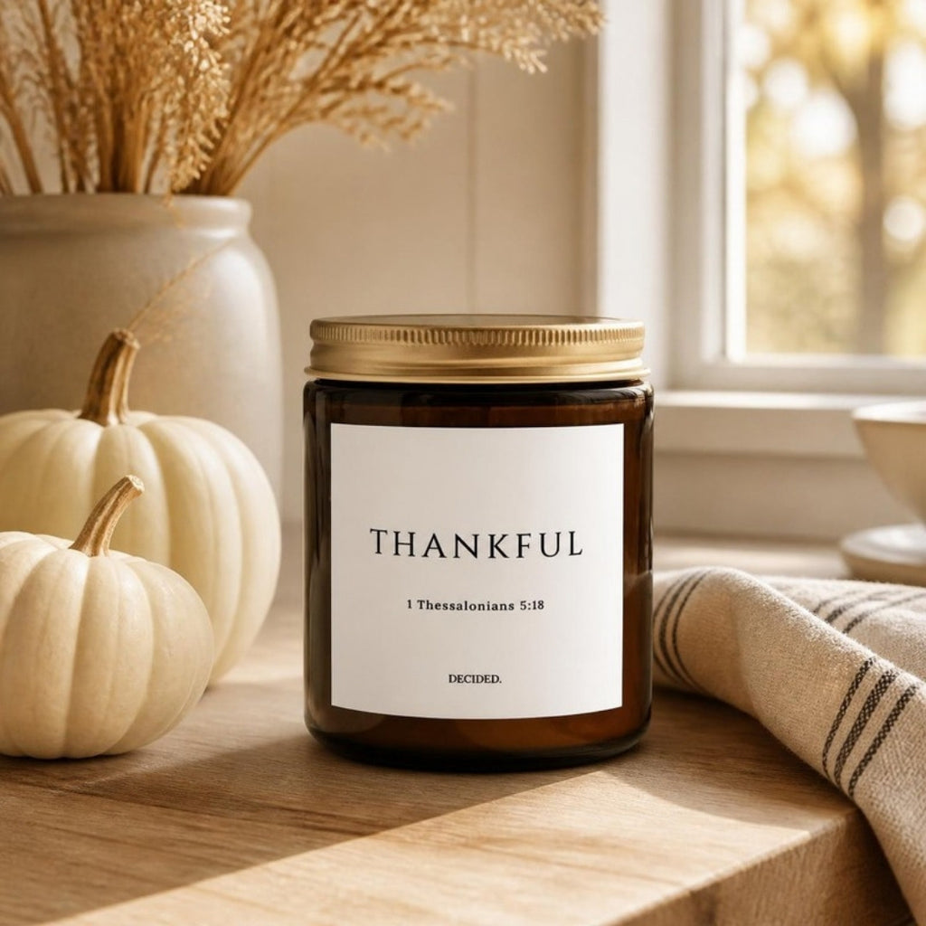 THANKFUL 1 Thessalonians 5:18 scripture candle styled in a cozy home setting - DECIDED.
